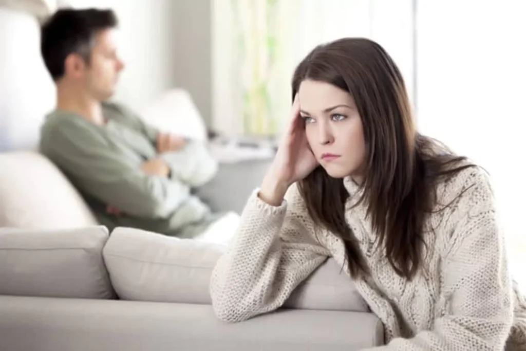 Married couple looking distressed, wondering if they should get a divorce