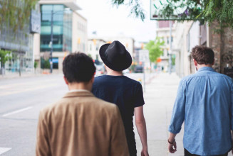 backs of heads three guys walking