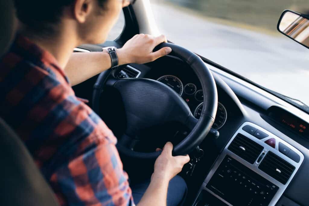 guy driving a car