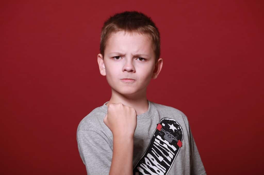 boy with fist raised