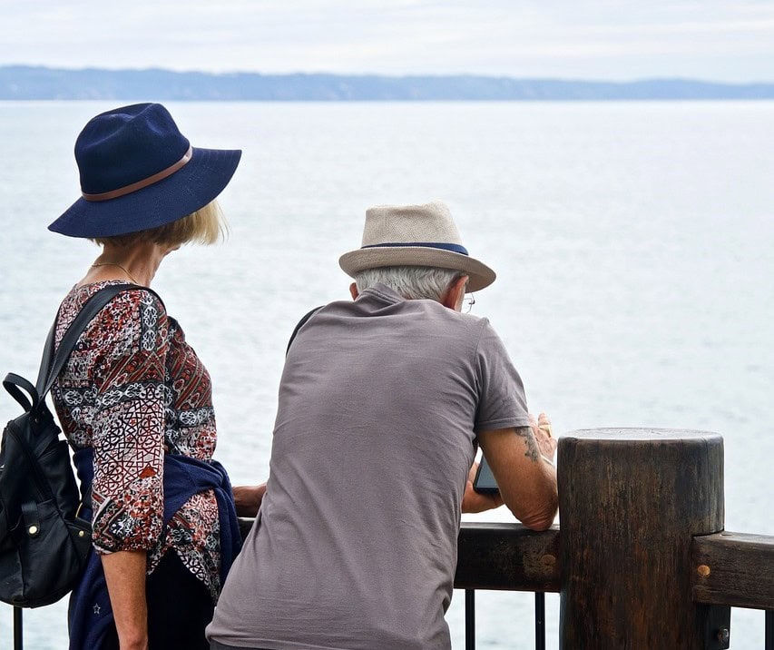 older couple looking out over water