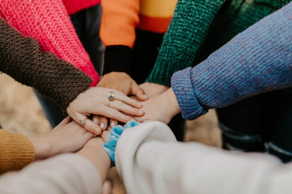 hands in the center for a cheer