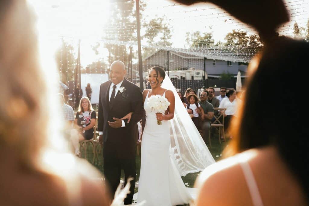 Father walking bride down aisle