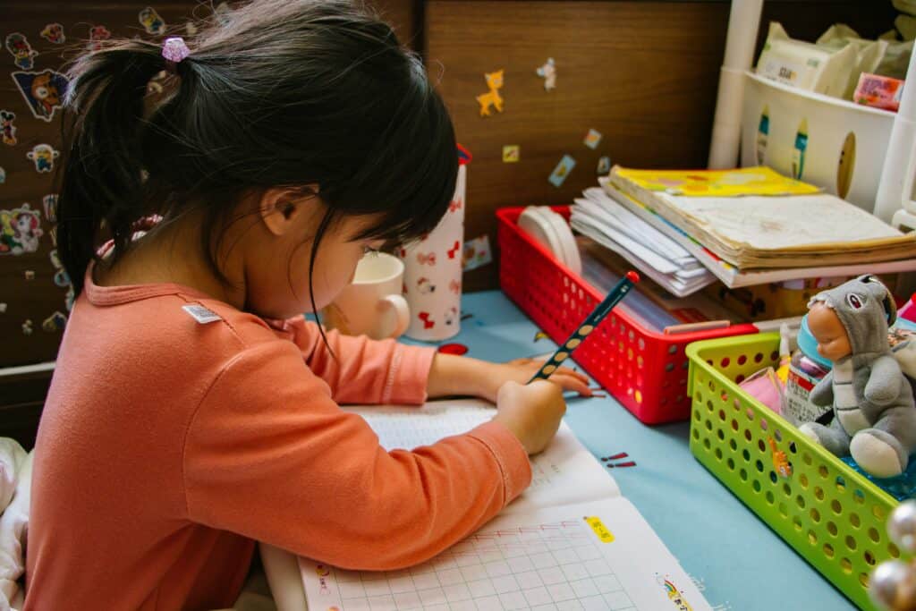 little girl writing