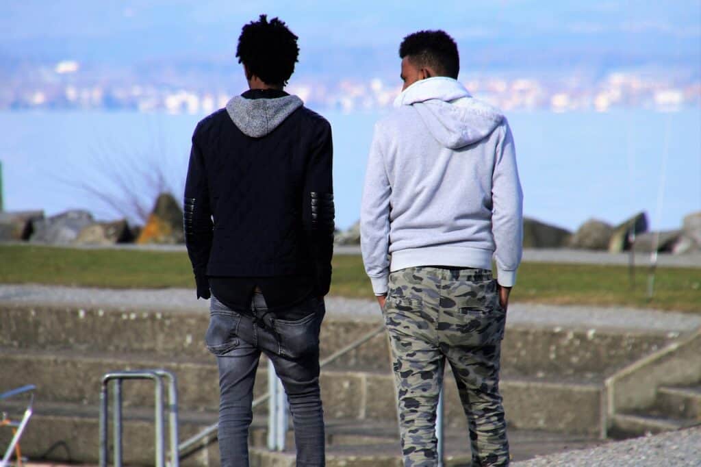 Two men walking side by side