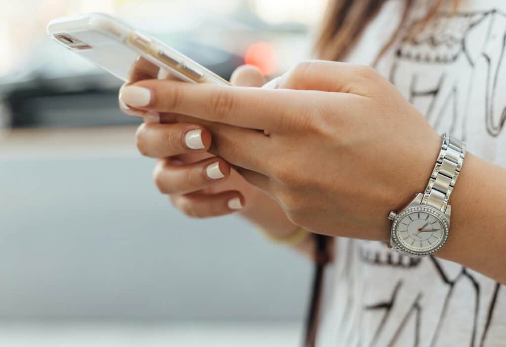 female hands holding phone