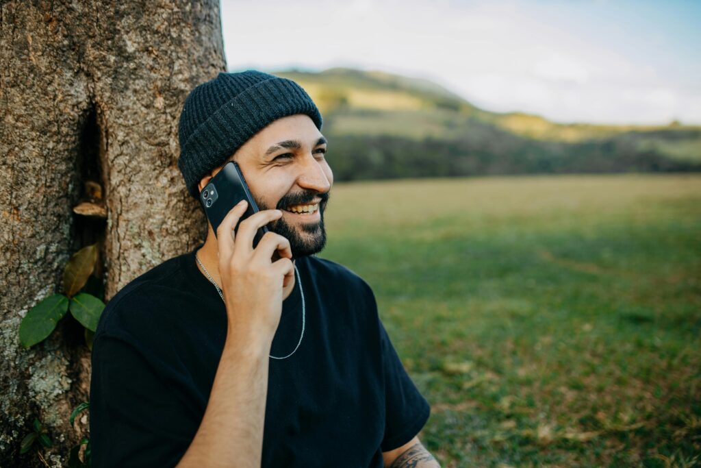 man smiling on phone