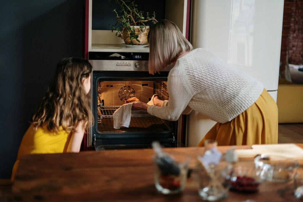 woman baking with daughter