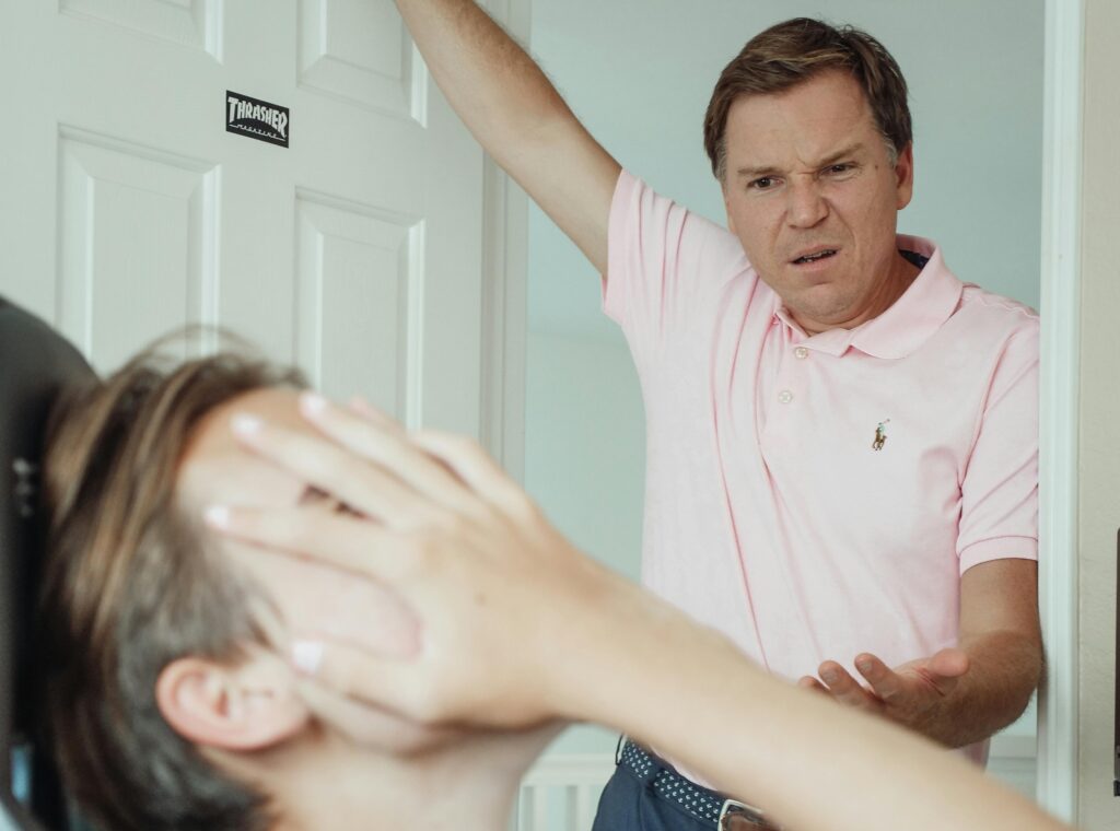 man angry critical at teen son