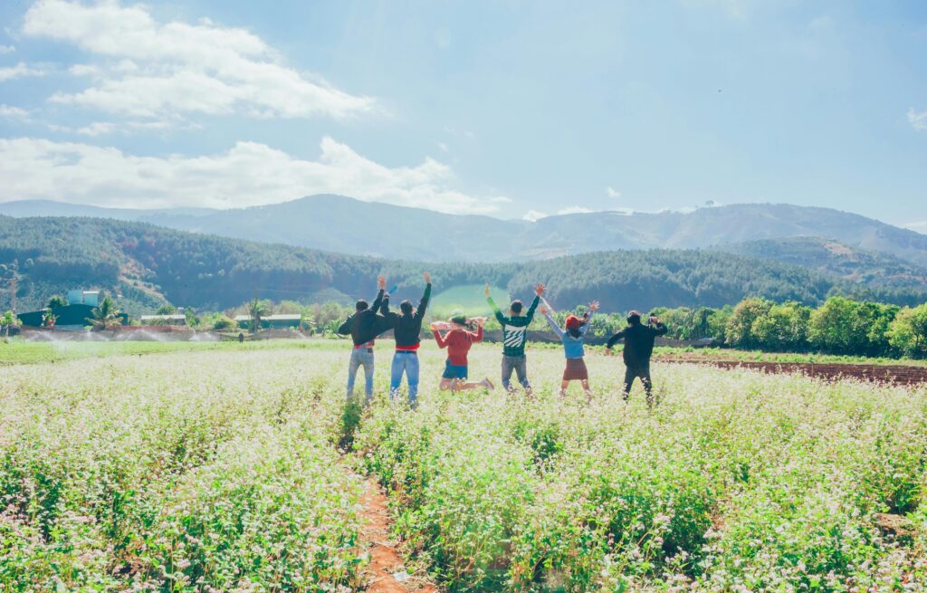 groups of people enthusiastic looking over farmland