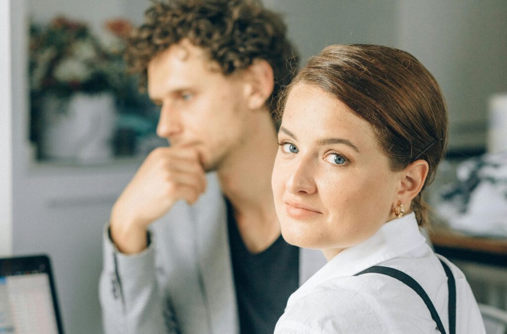 man and woman sitting together bored