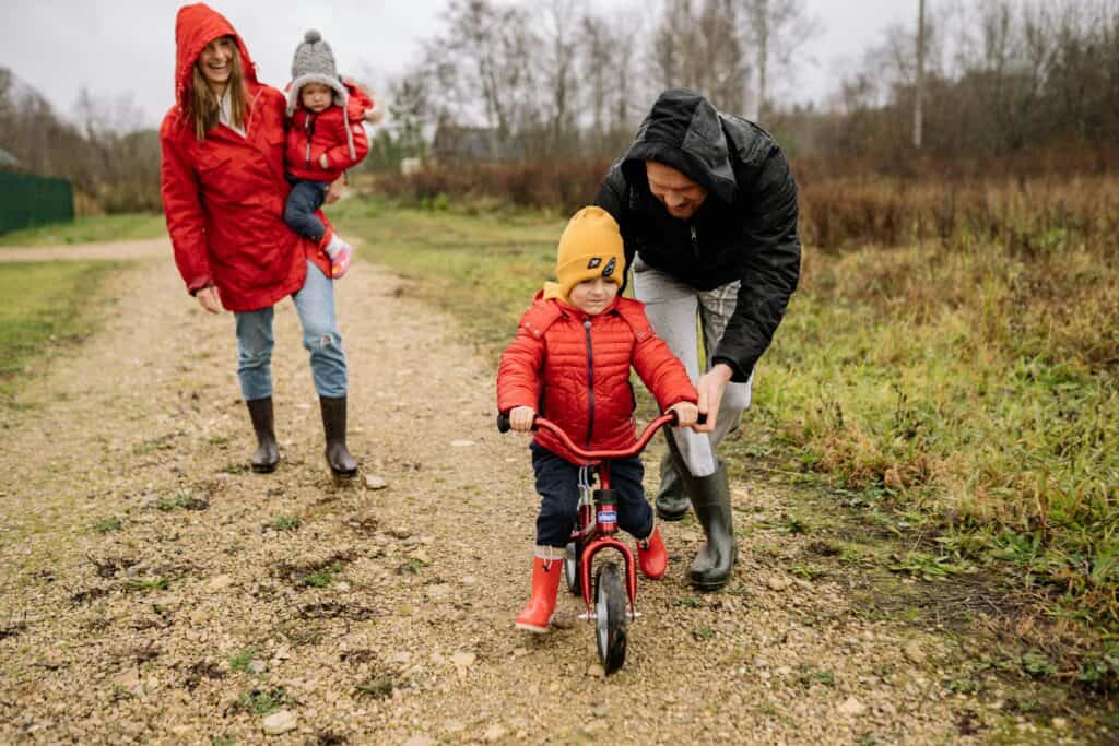 parents kids boy riding little bike