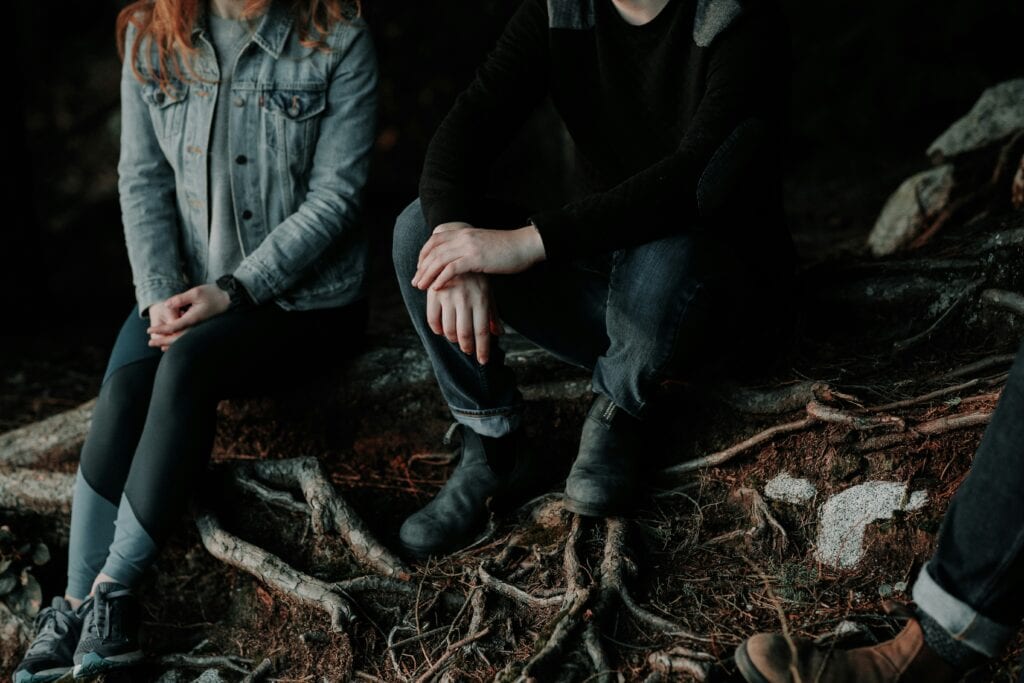 man and woman sitting side by side