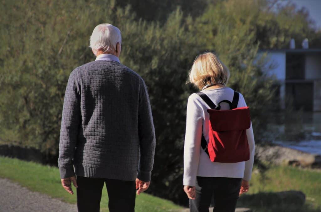 woman and older man walkin