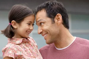 Time with dad is the key to relationship-building here is a dad and daughter smiling and touching foreheads