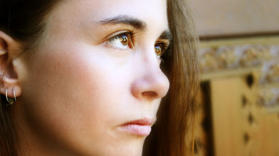 Close-up of the profile of a serious-looking teen girl's face