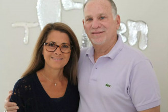 Bill and Vicki Rose smiling at the camera as they pose for a photo, showing how God redeemed their irretrievably broken marriage into a thriving one.