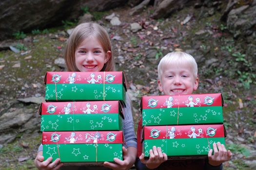 Lydia and Asa carrying presents