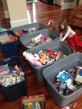 Lydia sorting gifts for Operation Christmas Child