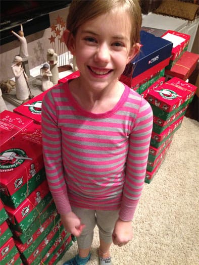 Lydia with 100 packed shoeboxes