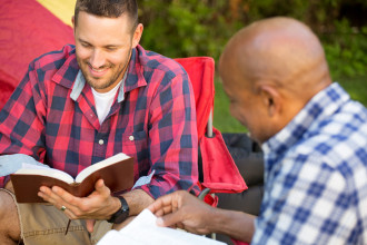 an older man mentoring a younger man