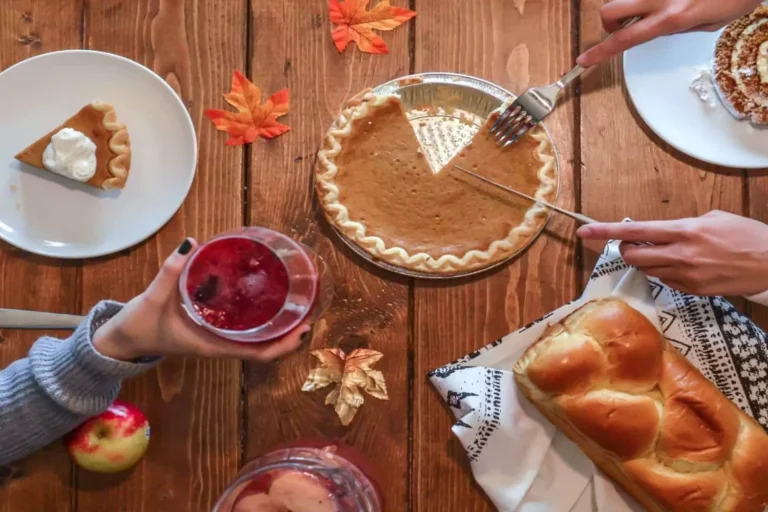 A family serves Thanksgiving dinner