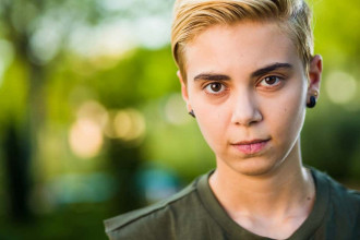 Close up of the face of a teen who's gender is ambiguous