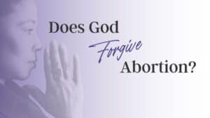 Woman praying wondering if God forgives abortion