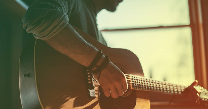 glorify God young man playing guitar