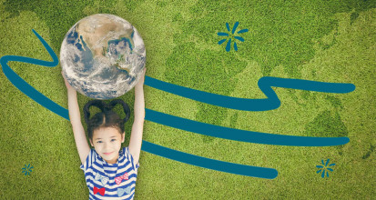 Girl holding up the planet earth