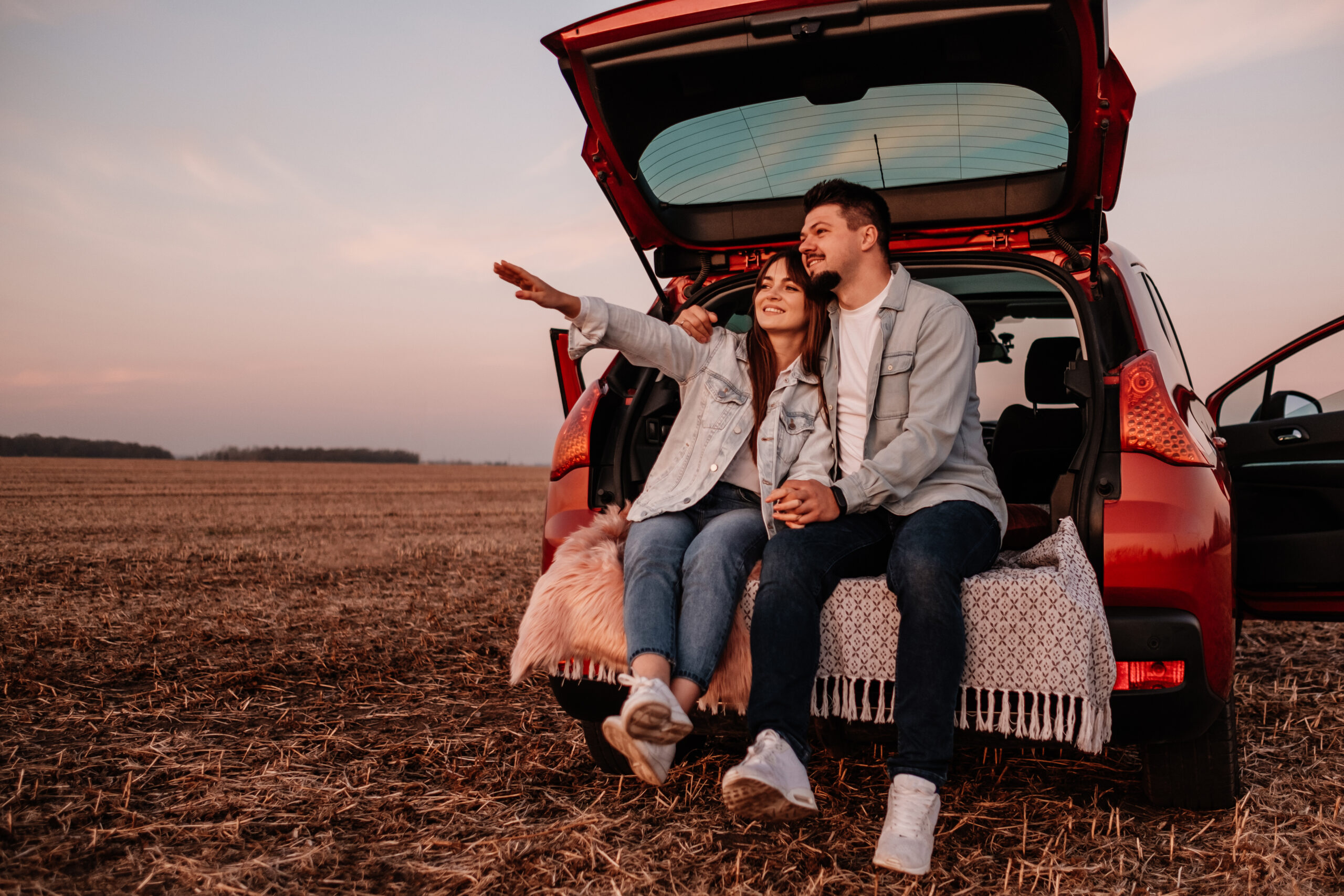 Licensed Reference this style 1 of 2 Use this image to generate new results that match its style. Save to Library Preview Crop Find Similar File #: 303072689 Young Happy Couple Dressed Alike in White Shirt and Jeans Sitting at Their New Car Trunk, Beautiful Sunset on the Field, Vacation and Travel Concept