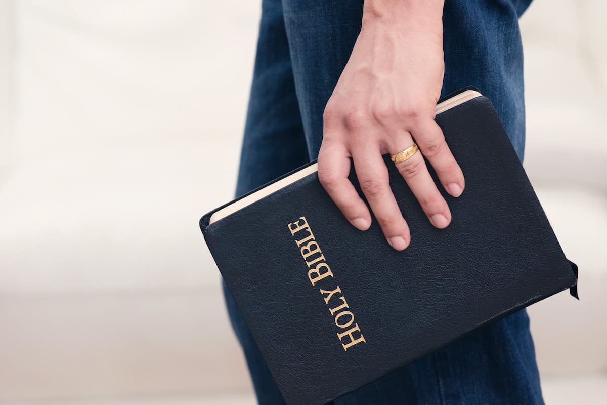 Adult Male Holding the Word of God