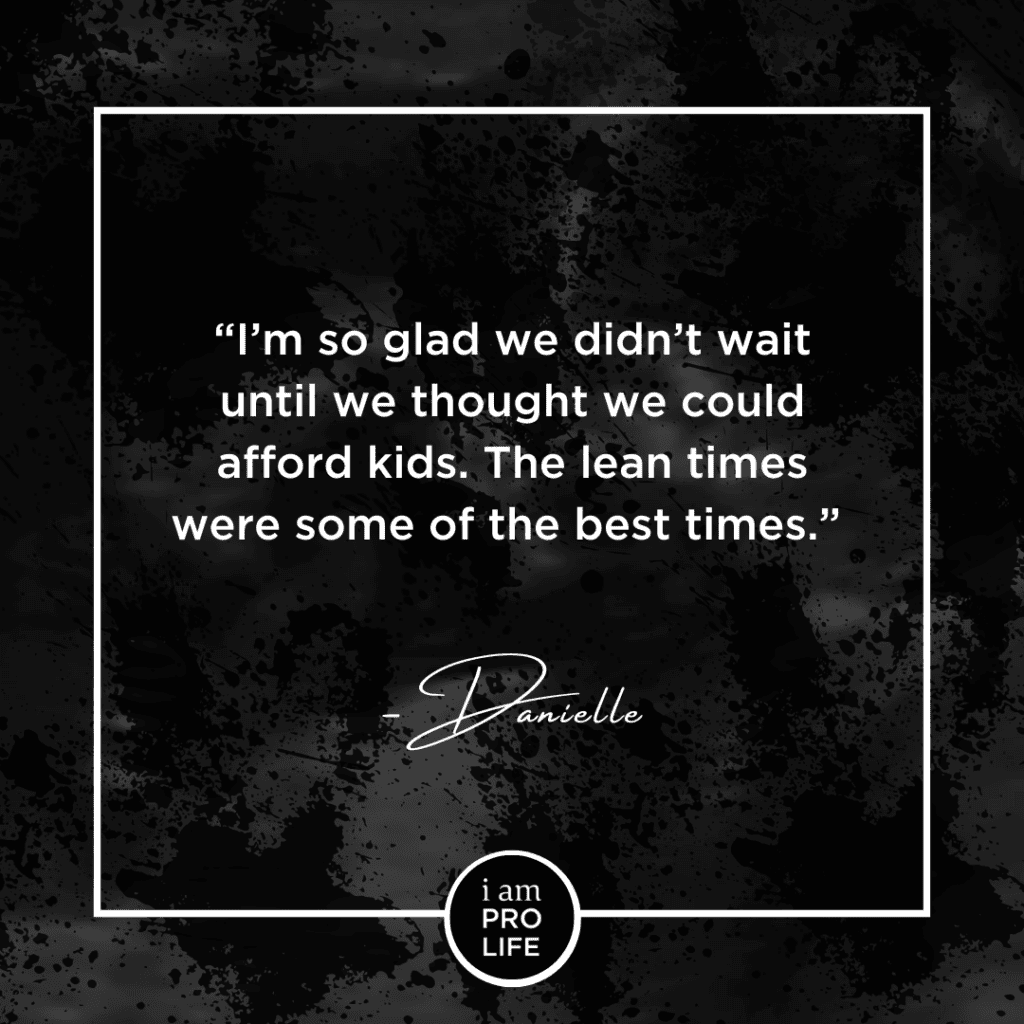 A black image with a faded ultrasound in the background. The foreground features white text that says: I'm so glad we didn't wait until we thought we could afford kids. The lean times were some of the best times. - Danielle