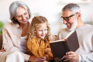 Grandparents reading the Bible to their grandchild