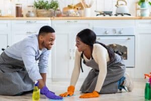A man and a woman are enjoying cleaning the floor together, helping each other as husband and wife. The Christian roles of husband and wife have gotten a bad rap. Have your view of marital roles and submission have been smaller than God’s?
