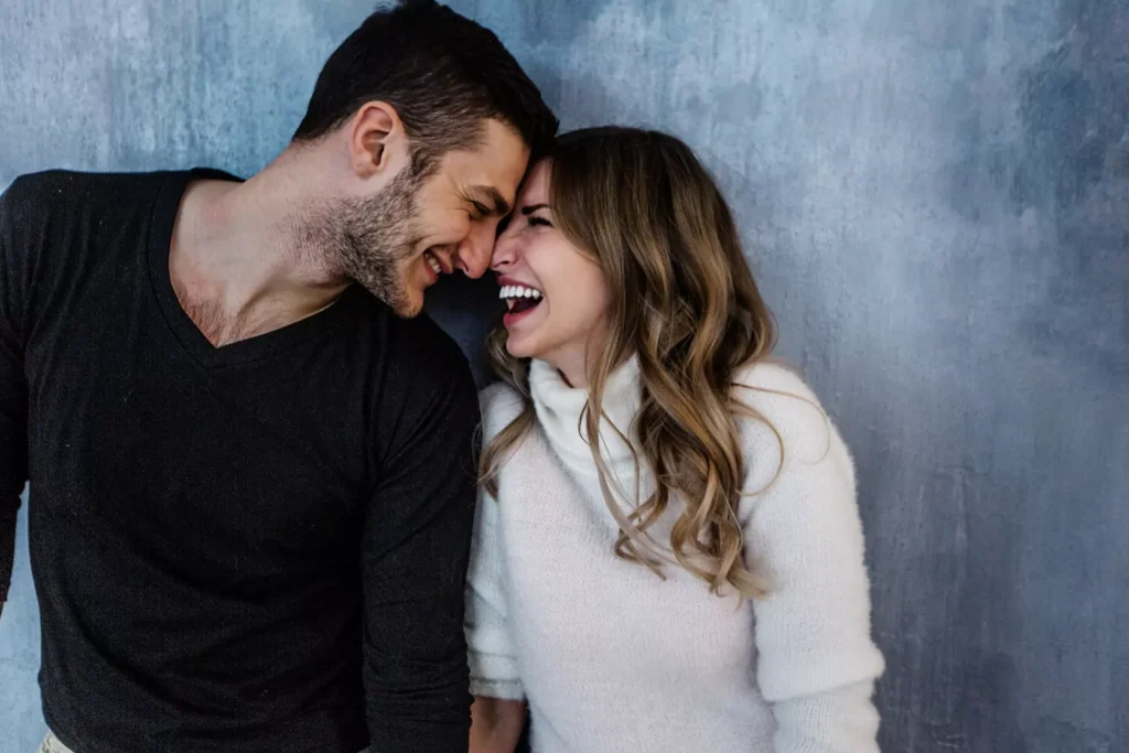 A man and a woman stand pressing their foreheads against each other lovingly and with joy in their hearts. Our childhood experiences and the way our parents related to us have imprinted certain love styles and behaviors on us.