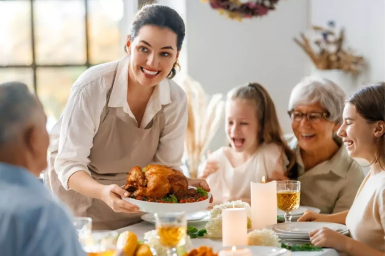 Three generations of a family gathered at the dinner table for a Thanksgiving dinner