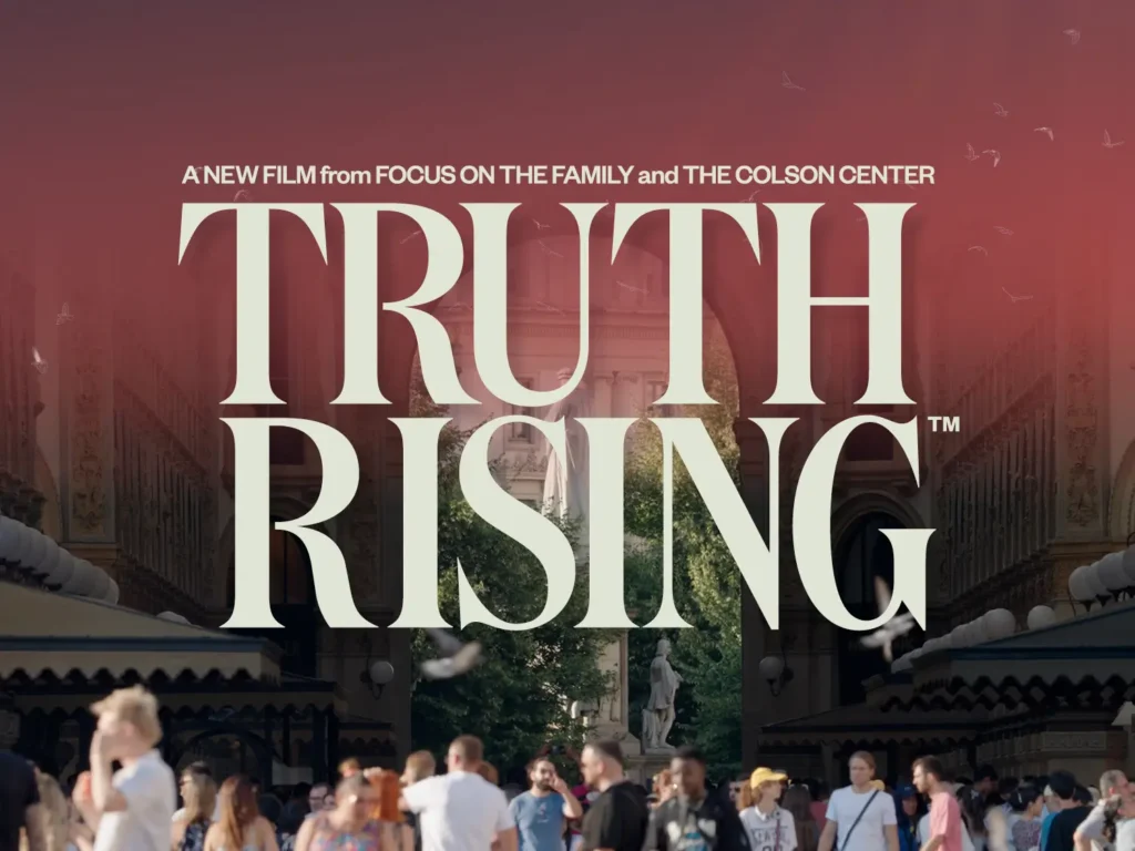 Text reads, "Truth Rising, A new film from Focus on the Family and the Colson Center: Background image of crowd in front of arch with overlaying red gradient.