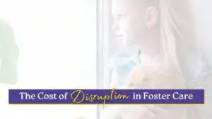 Young girl staring out a window, symbolizing the emotional impact of disruption in foster care.